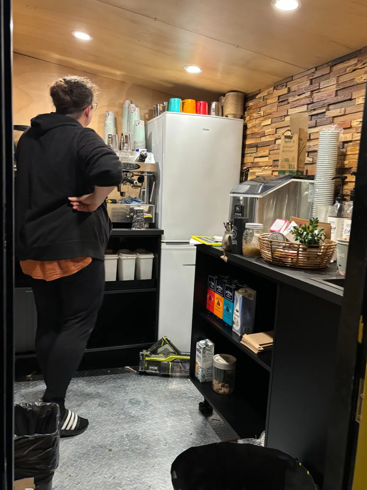 Inside the Magic Bean cart showing the Fracino coffee machine, fridge, ice maker, storage and reclaimed timber feature wall